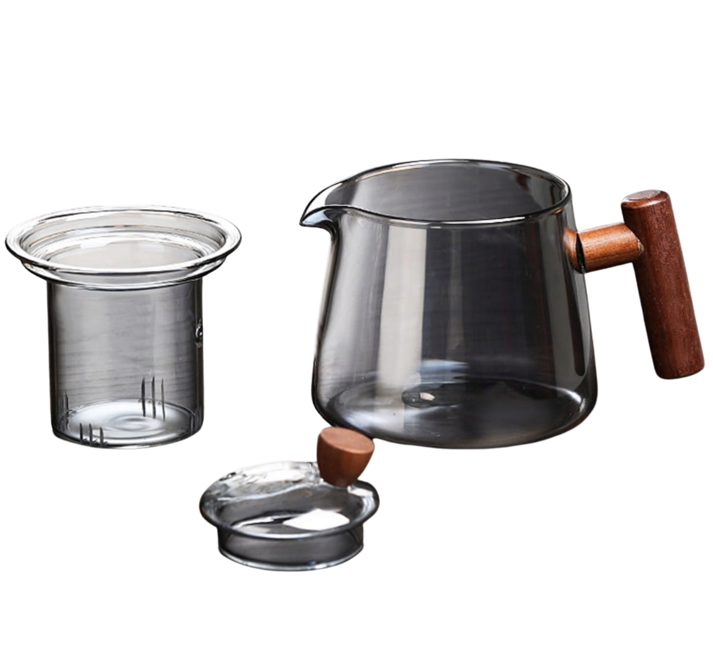 Czajnik szklany z wyjmowanym zaparzaczem i pokrywką obok.