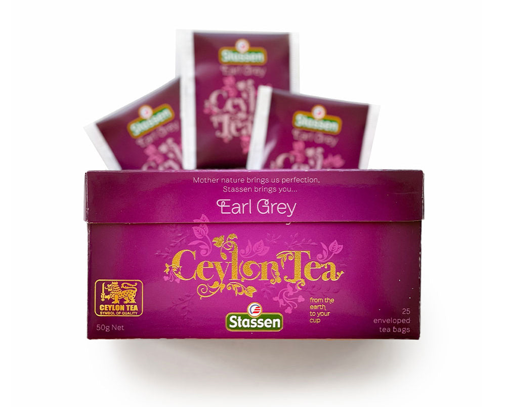 Koperty Stassen Earl Grey obok pudełka – czarna herbata aromatyzowana bergamotką.