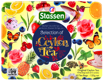 Bok pudełka herbat Stassen z ilustracjami owoców i motyli.