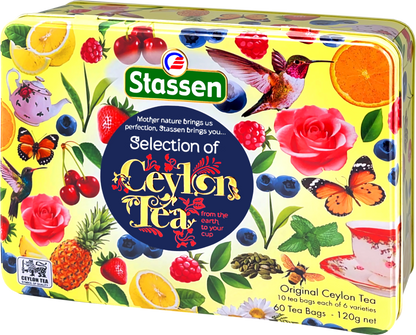 Zbliżenie na metalową puszkę Stassen Selection of Ceylon Tea z napisem i motywem kolibrów.
