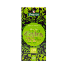 Widok z góry na opakowanie herbaty Stassen Apple Tea z ozdobnym motywem jabłek.