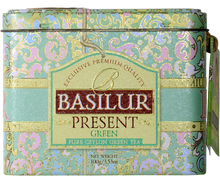Front opakowania herbaty Basilur Present Green z eleganckim zdobieniem.