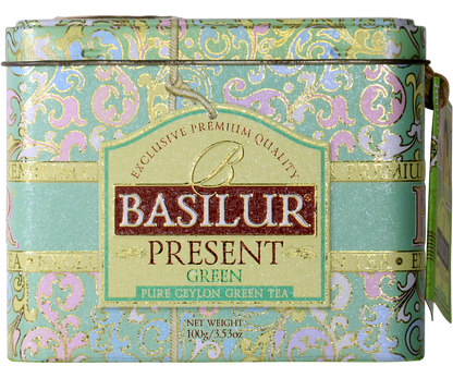 Front opakowania herbaty Basilur Present Green z eleganckim zdobieniem.