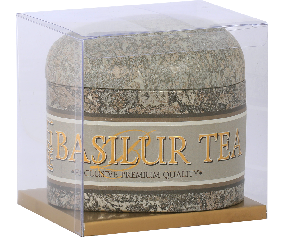 Puszka herbaty Basilur Oolong Green Tea w kamiennym stylu w przezroczystym opakowaniu.