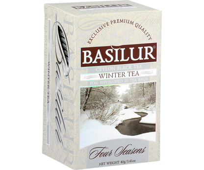 Bok i przód pudełka herbaty Basilur Winter Tea 40 g z nadrukiem śnieżnego pejzażu.