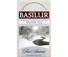 Front opakowania herbaty Basilur Winter Tea Four Seasons z zimowym krajobrazem.