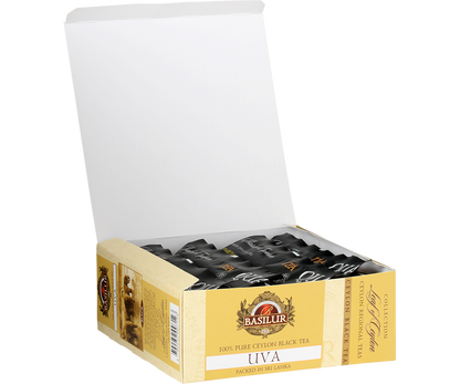 Otwarte pudełko herbaty Basilur Uva z czarnymi saszetkami herbaty cejlońskiej.