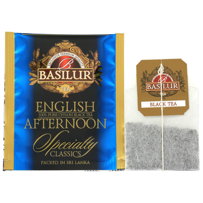 Saszetka herbaty Basilur English Afternoon w złoto-niebieskiej kopercie i torebka z logo Basilur.