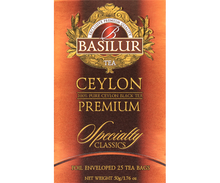 Przód opakowania Basilur Ceylon Premium w pomarańczowo-złotych barwach.