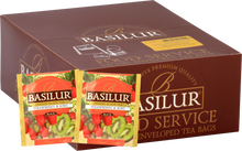 Opakowanie herbaty Basilur Strawberry & Kiwi z widocznymi saszetkami czarnej herbaty owocowej z truskawką i kiwi.