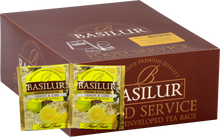 Opakowanie herbaty Basilur Lemon & Lime z widocznymi saszetkami czarnej herbaty z cytryną i limonką.