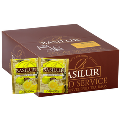 Opakowanie herbaty Basilur Lemon & Lime z widocznymi saszetkami czarnej herbaty z cytryną i limonką.