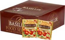 Opakowanie herbaty Basilur Raspberry & Rosehip z widocznymi saszetkami czarnej herbaty owocowej z maliną i dziką różą.