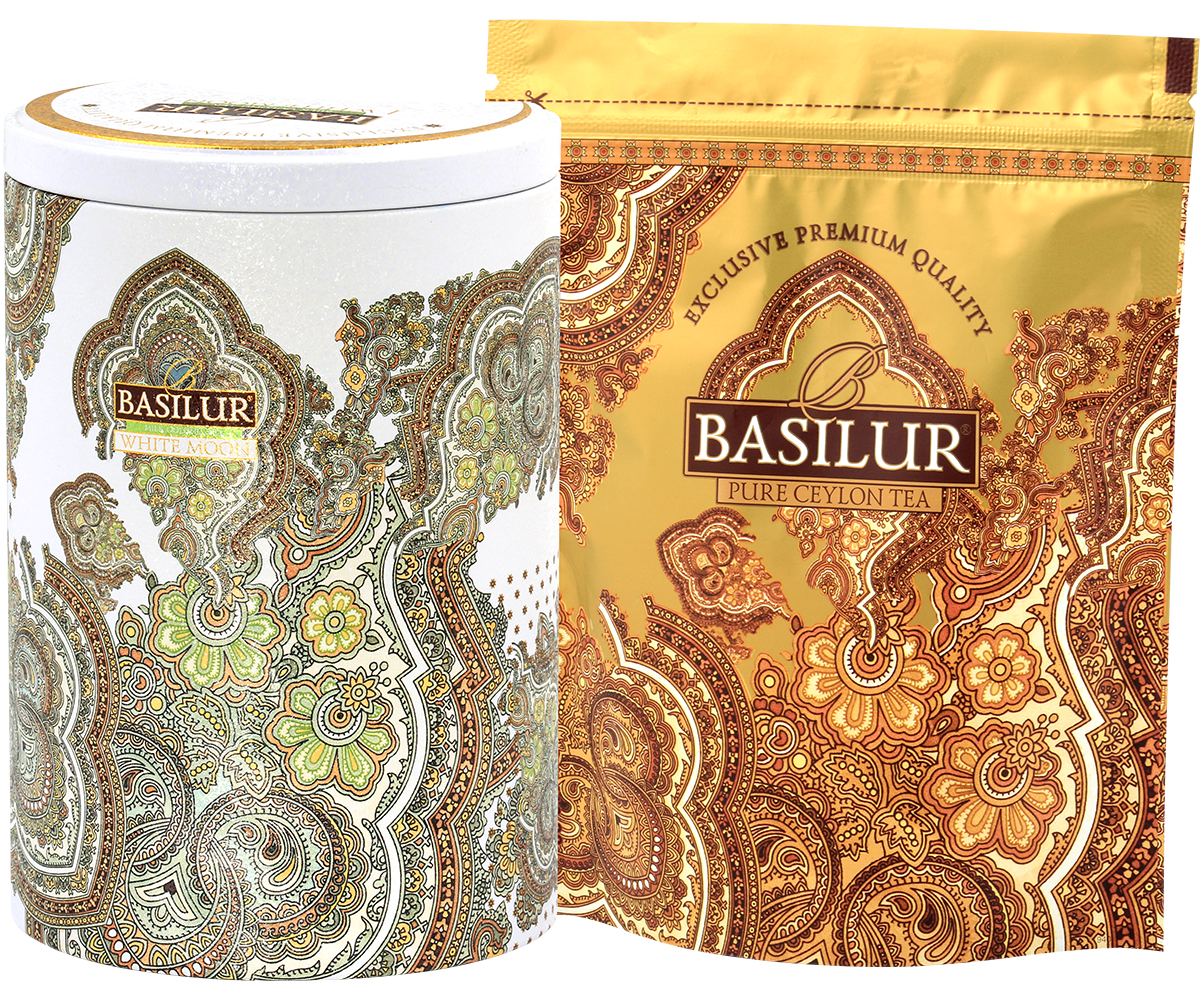 Zestaw herbaty Basilur White Moon – elegancka puszka i złote opakowanie z liśćmi herbaty.