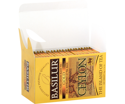 Otwarte pudełko z kopertami herbaty Basilur Gold.