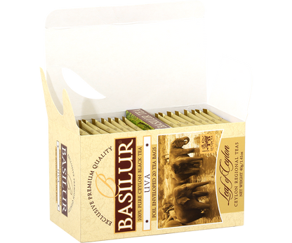 Otwarte pudełko Basilur Uva z kopertami herbaty.