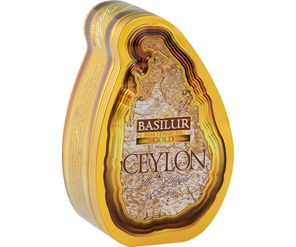 Herbata Basilur Gold w ozdobnym, metalowym opakowaniu widziana z lewej strony.