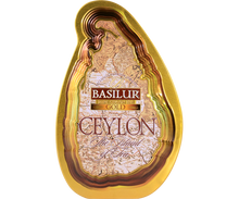 Złota puszka Basilur Gold z mapą Cejlonu na przodzie.