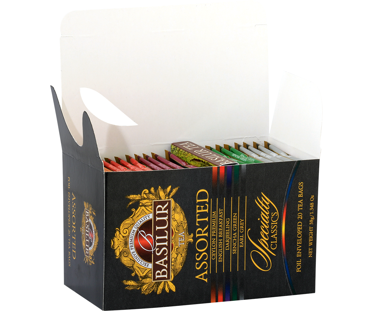 Otwarta paczka Basilur Assorted z widocznymi saszetkami herbat.