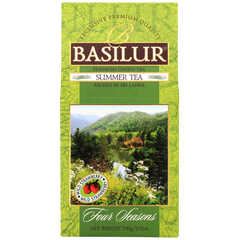 Zielona herbata Basilur Summer Tea – opakowanie z grafiką natury i jeziorem.
