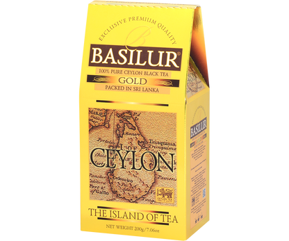 Herbata Basilur Gold widoczna z lewej strony, elegancki złoty karton.