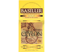 Opakowanie herbaty Basilur Gold z mapą Cejlonu w złotej stylistyce.