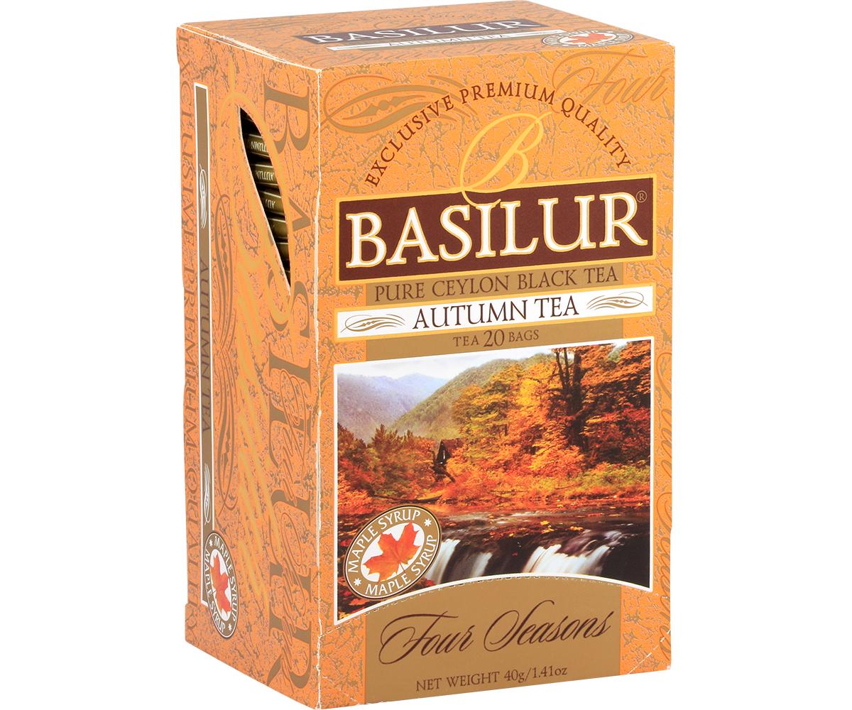 Opakowanie herbaty Basilur Autumn Tea w pomarańczowym kolorze z górskim motywem.