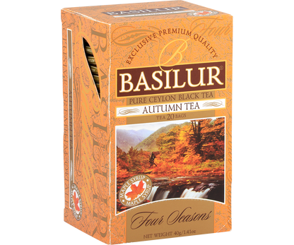 Opakowanie herbaty Basilur Autumn Tea w pomarańczowym kolorze z górskim motywem.