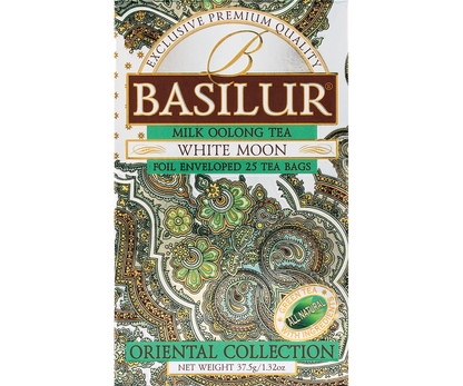 Zbliżenie na opakowanie Basilur White Moon, delikatny design w kolorach bieli i zieleni.