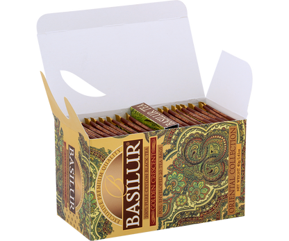 Otwarta herbata Basilur Golden Crescent z widocznymi kopertami zapakowanymi w ozdobne pudełko.