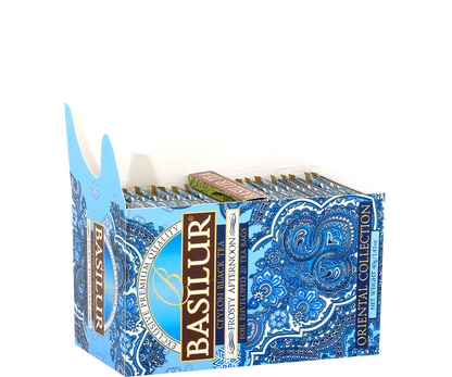 Otwarta herbata Basilur Frosty Afternoon z kopertami w ozdobnym błękitnym pudełku.