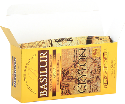 Otwarte pudełko Basilur Gold z widocznymi torebkami herbaty.