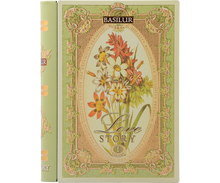 Puszka w kształcie książki Basilur Love Story vol. I z kwiatowym motywem na okładce.