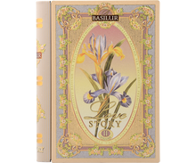 Herbata Basilur Love Story vol. II w ozdobnym opakowaniu przypominającym książkę z motywem irysów.