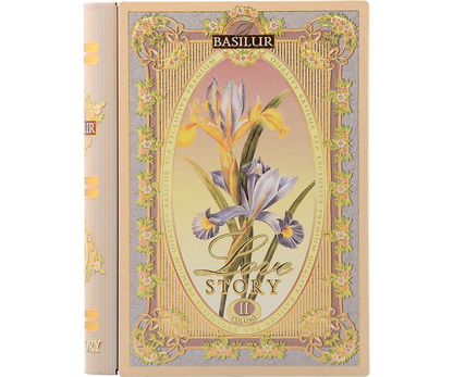 Herbata Basilur Love Story vol. II w ozdobnym opakowaniu przypominającym książkę z motywem irysów.