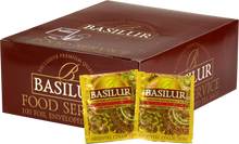 Opakowanie herbaty Basilur Golden Crescent 100 x 2 g z kolekcji Oriental Collection w złotej szacie graficznej.