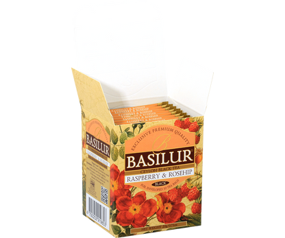 Otwarta paczka herbaty Basilur Raspberry & Rosehip z widocznymi saszetkami w środku.