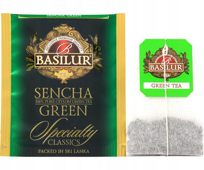 Saszetka zielonej herbaty Basilur Sencha Green w zielono-złotej kopercie z zawieszką Basilur.
