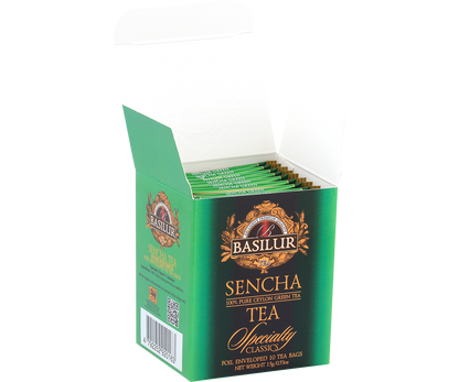 Otwarte pudełko herbaty Basilur Sencha z kopertowanymi torebkami w środku.
