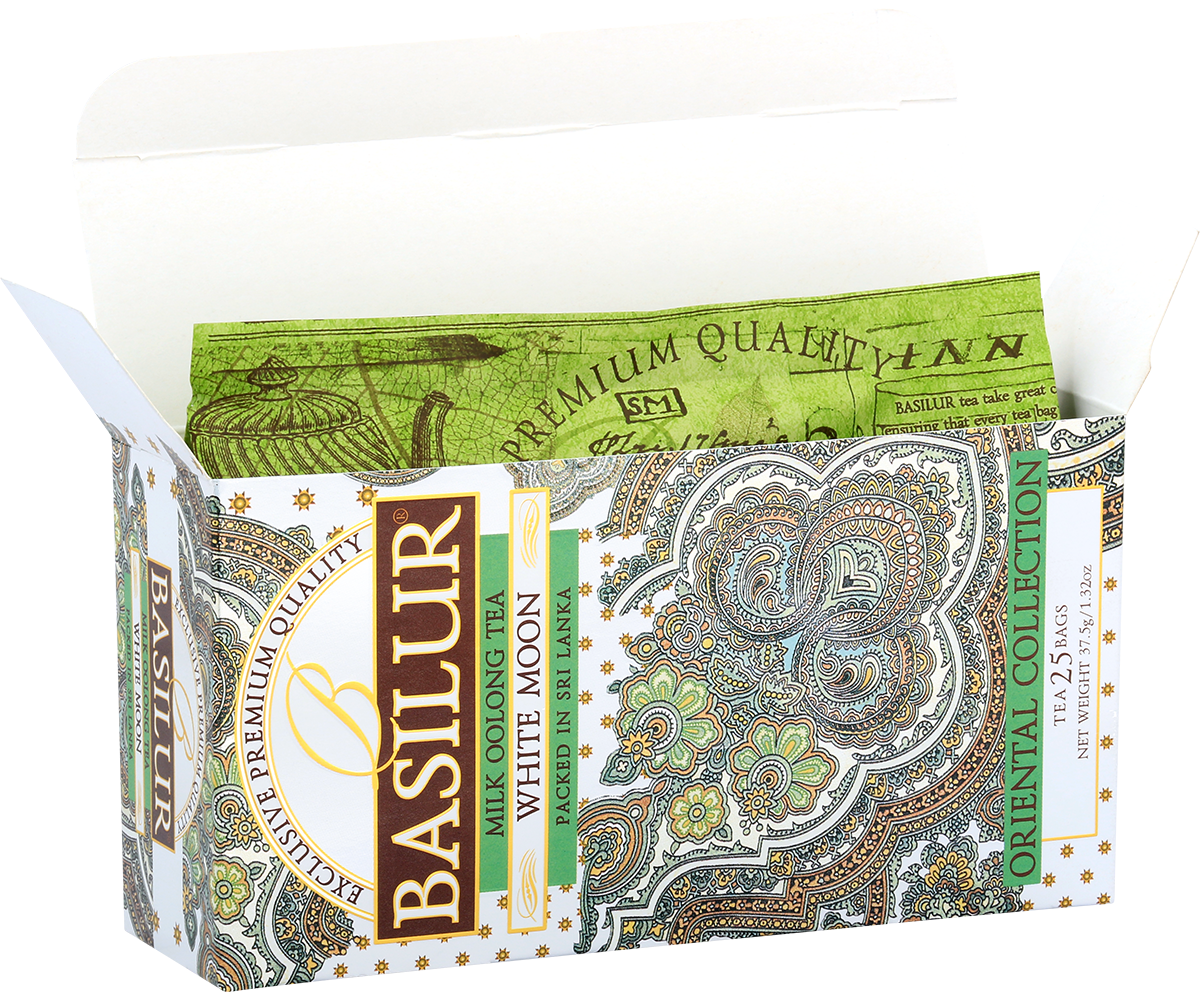 Otwarte pudełko Basilur White Moon – eleganckie wnętrze z zielonym motywem.