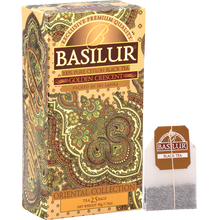 Pudełko Basilur Golden Crescent wraz z torebką herbaty z logo marki.