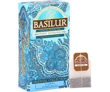 Herbata Basilur Frosty Afternoon z torebką herbaty obok opakowania.