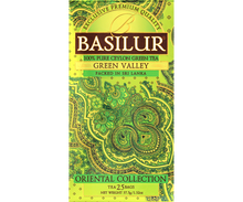 Przód opakowania herbaty Basilur Green Valley – eleganckie zielono-złote wzornictwo.