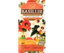 Herbata Basilur Blood Orange – front pudełka z motywem pomarańczy i kwiatów.
