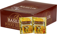 Opakowanie herbaty Basilur Mango & Pineapple 100 x 2 g z owocami mango i ananasa na torebkach.