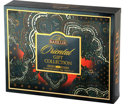 Widok z boku i przodu pudełka Basilur Oriental Gift Collection w ciemnych, złotych barwach.