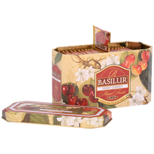 Otwarta puszka Basilur Sweet Cherry z widocznymi kopertami herbaty o wiśniowym aromacie.