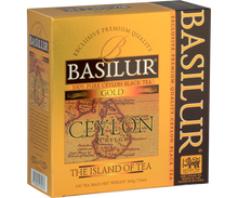 Herbata Basilur Gold – złote opakowanie z mapą Cejlonu, 100 torebek herbaty.