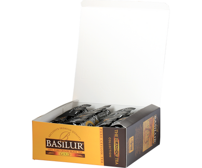 Otwarte pudełko Basilur Gold z torebkami czarnej herbaty cejlońskiej.