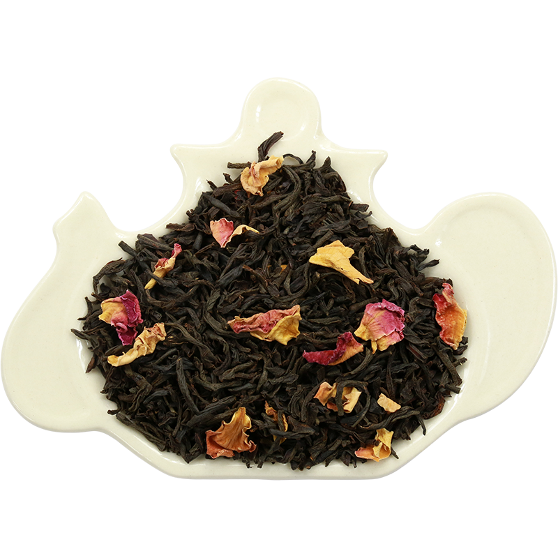 Liście czarnej herbaty Basilur English Rose z płatkami róż na porcelanowej podstawce